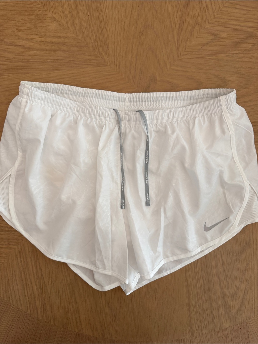 Nike Women's White Athletic Running Shorts with Gray Swoosh